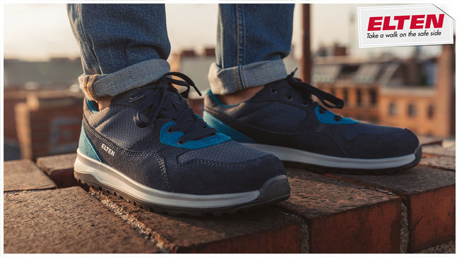 ELTEN Sicherheitsschuh S1P Journey blue low ESD auf einer Steinmauer.